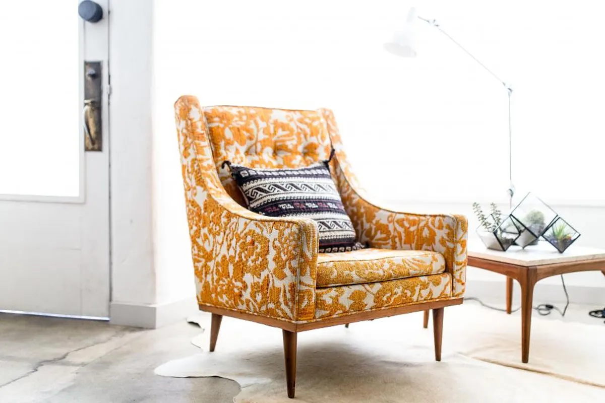 yellow patterned armchair in a bright room