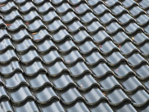 dark stone-coated metal roof panels