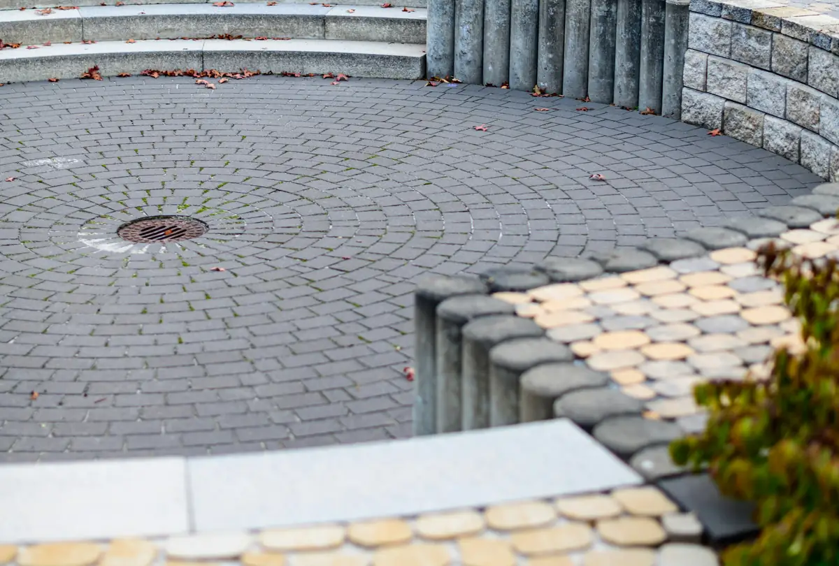 After: stained, faded paver courtyard restored to clean, sealed pavers