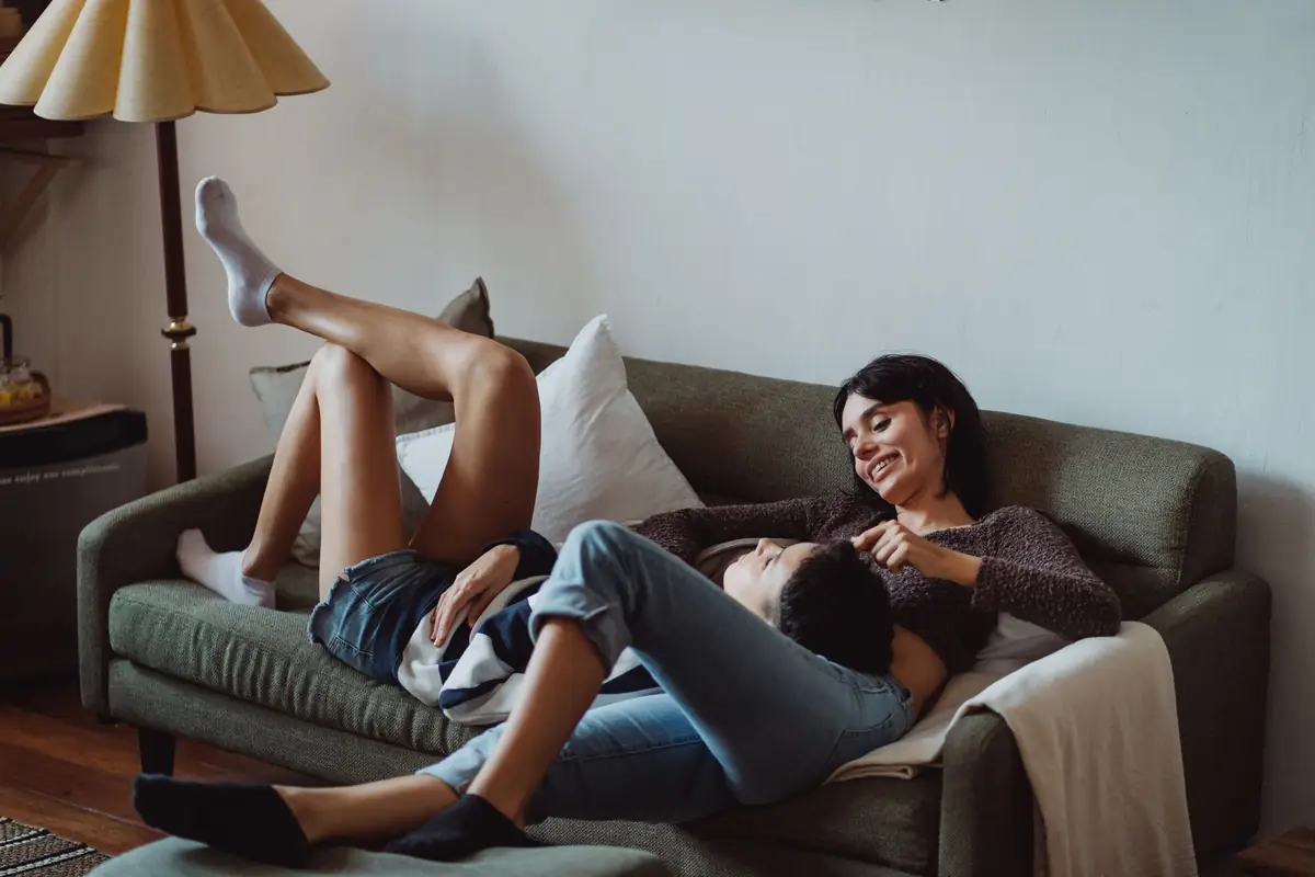 couple relaxing on a sofa in a cool, comfortable living room